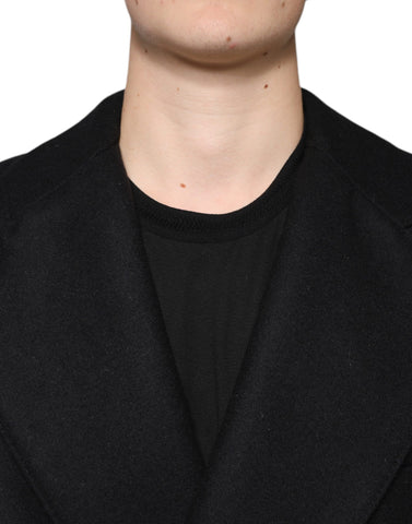 Black wool double-breasted men's coat jacket by Dolce & Gabbana, featuring classic lapels and button details.