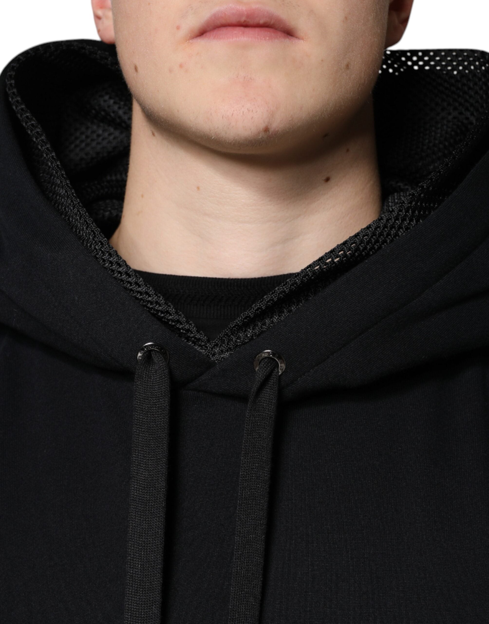 Black hooded pullover sweatshirt for men by Dolce & Gabbana, featuring a casual fit and soft fabric, shown on a neutral background.