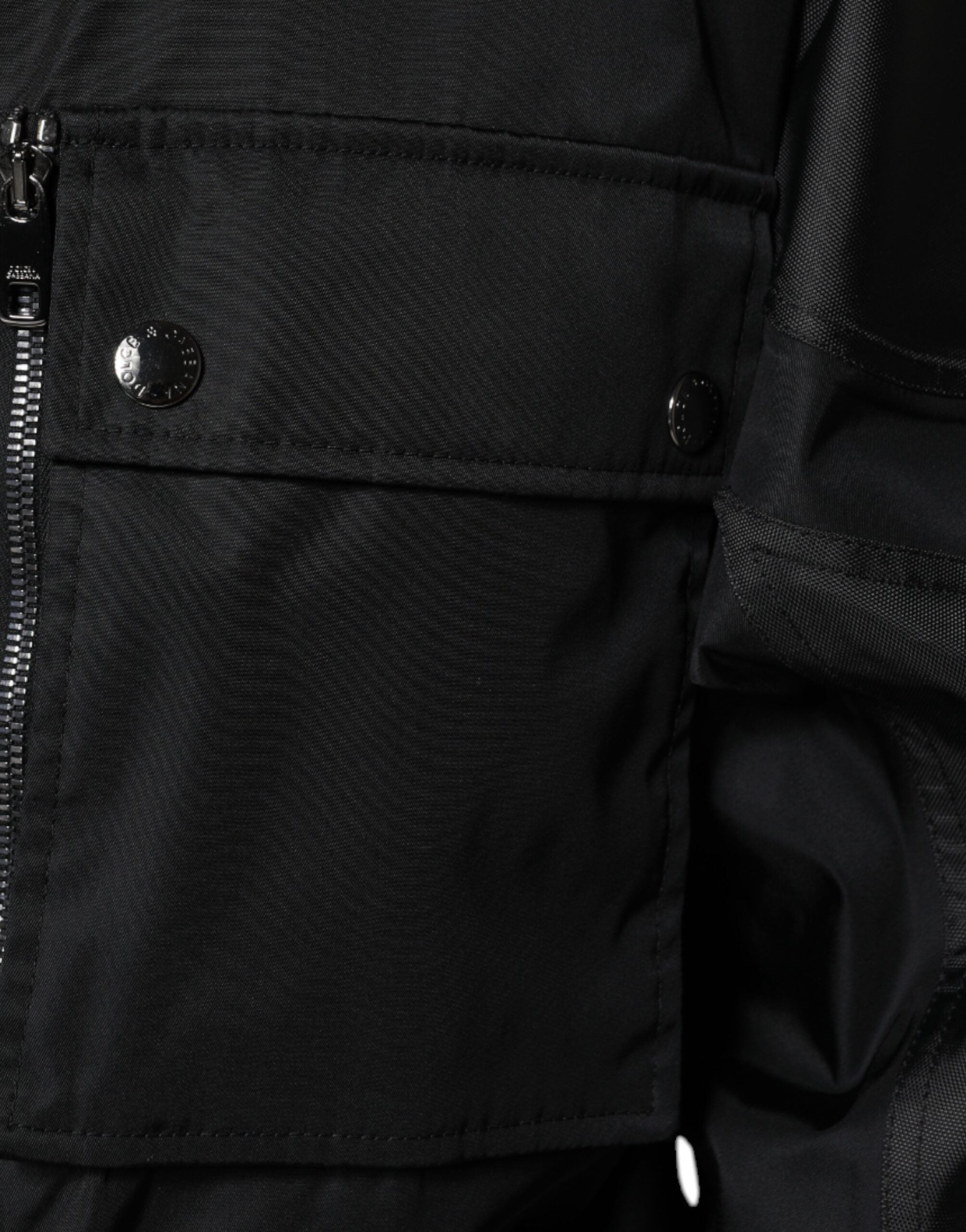 Black nylon winter men's parka coat by Dolce & Gabbana, showing the insulated jacket with a hood and zipper closure.