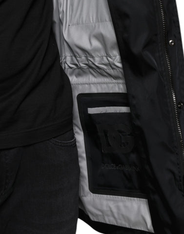 Black nylon winter men's parka coat by Dolce & Gabbana, featuring a hood, front zipper, and insulated design for cold weather.