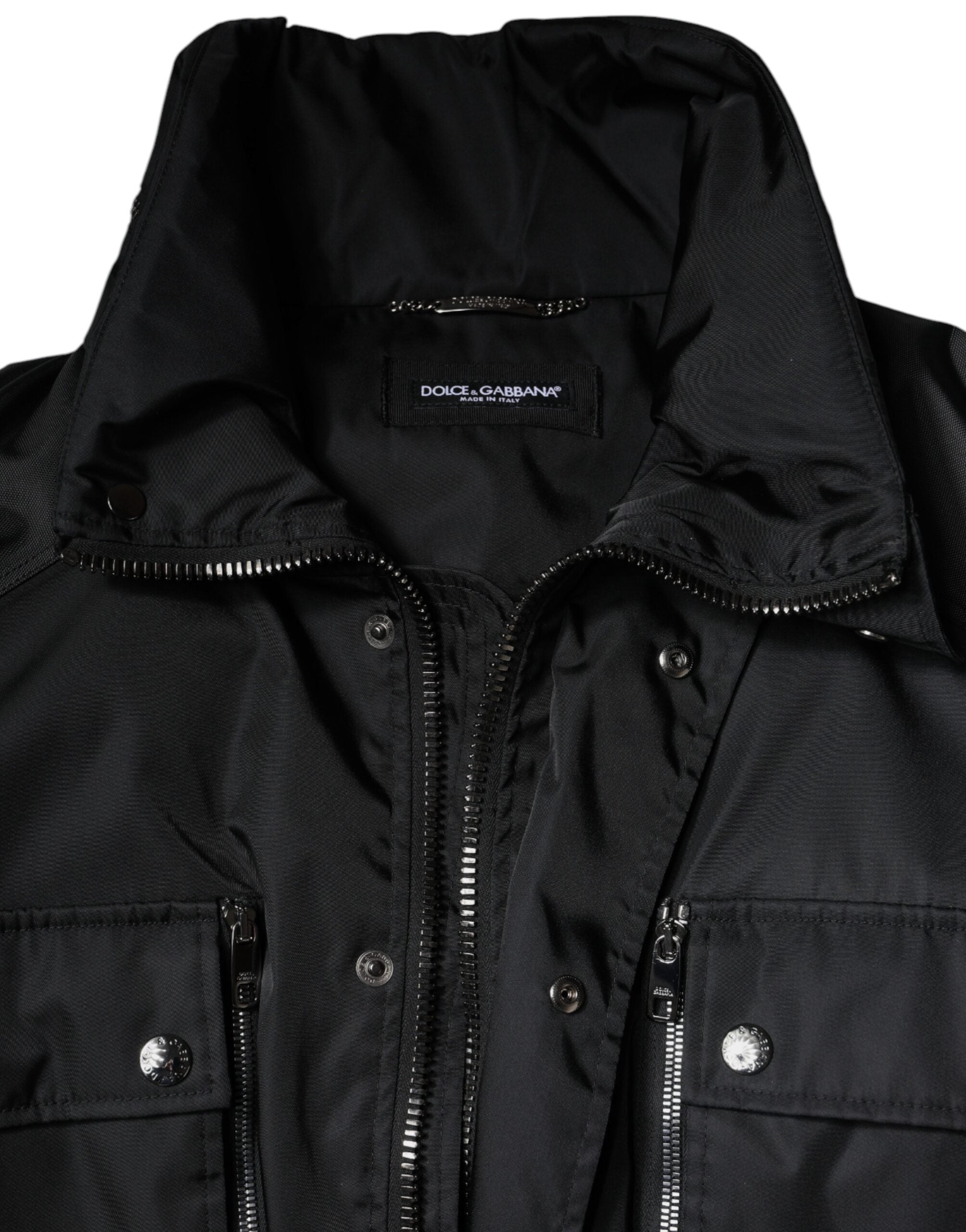 Black nylon winter men's parka coat by Dolce & Gabbana with a hood and zipper closure, suited for cold weather.