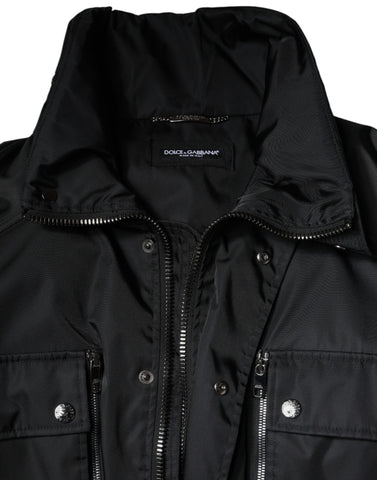 Black nylon winter men's parka coat by Dolce & Gabbana with a hood and zipper closure, suited for cold weather.