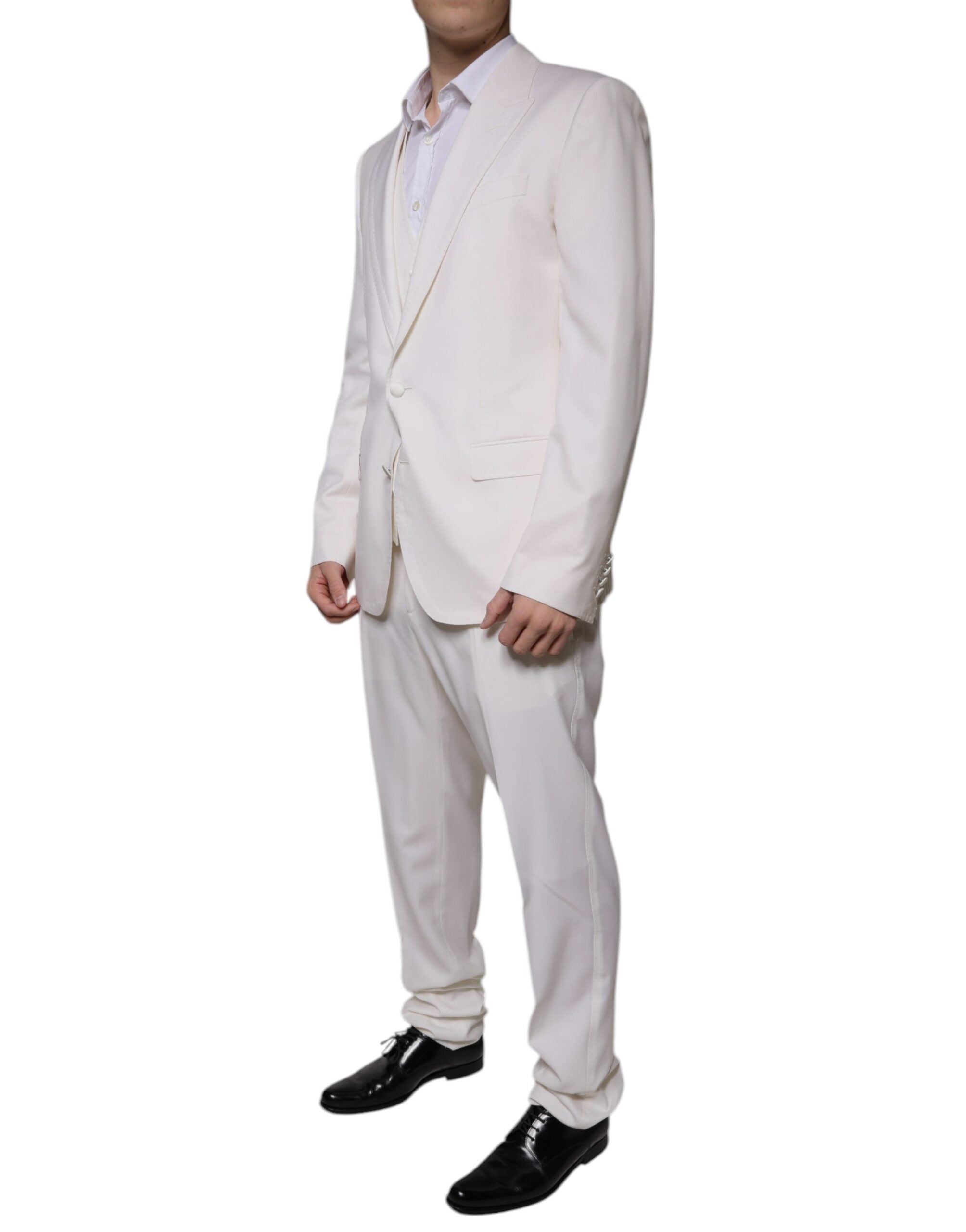 White wool silk slim-fit formal suit by Dolce & Gabbana, featuring a tailored jacket, matching trousers, and a dress shirt.