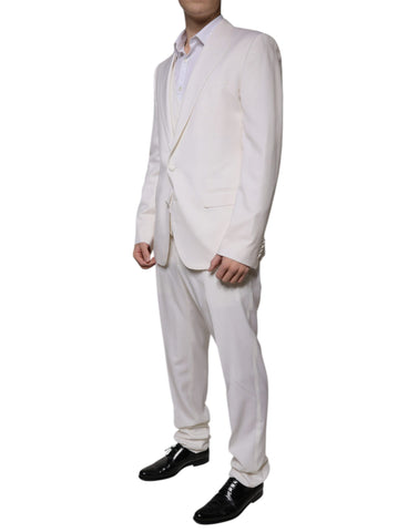 White wool silk slim-fit formal suit by Dolce & Gabbana, featuring a tailored jacket, matching trousers, and a dress shirt.