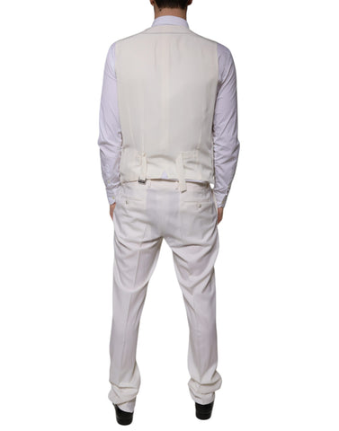 White wool silk slim-fit formal suit by Dolce & Gabbana, includes jacket, trousers, and vest, tailored for a sharp look.