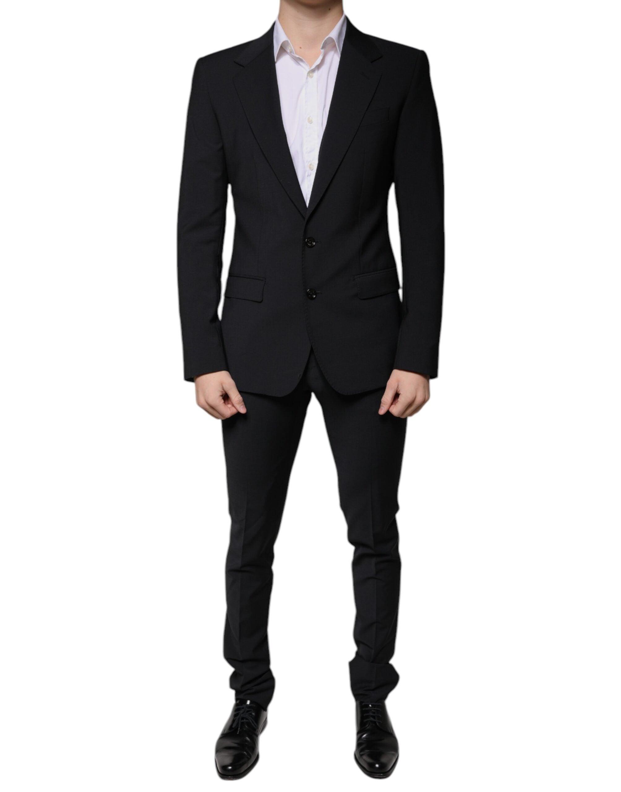 Black wool slim fit formal men’s suit by Dolce & Gabbana, featuring a tailored jacket, matching trousers, and a classic shirt.