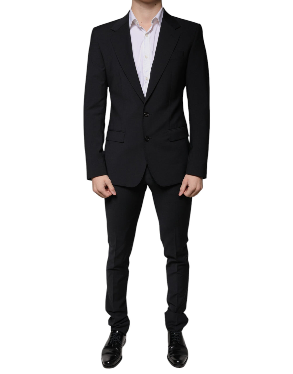 Black wool slim fit formal men’s suit by Dolce & Gabbana, featuring a tailored jacket, matching trousers, and a classic shirt.