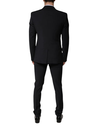 Black wool three-piece slim fit men's formal suit by Dolce & Gabbana, featuring a jacket, vest, and trousers.