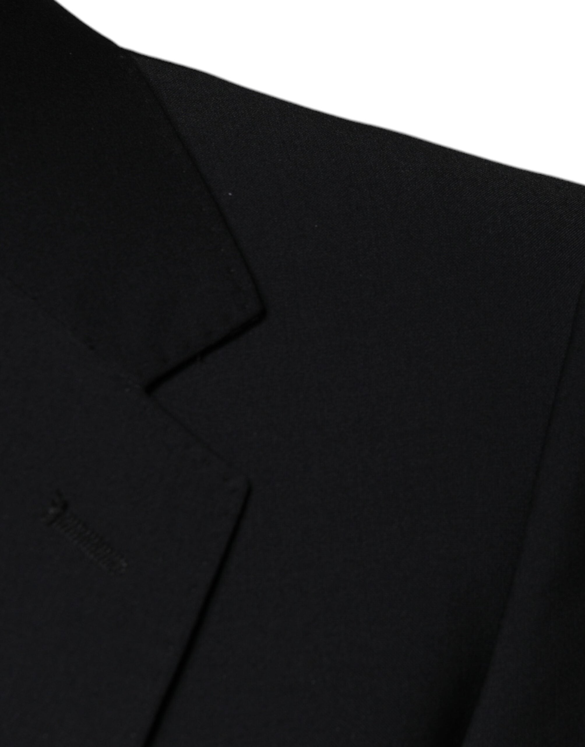 Black wool 3-piece slim fit formal men's suit by Dolce & Gabbana, including jacket, vest, and trousers, displayed on a hanger.