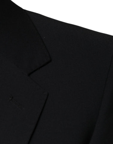 Black wool 3-piece slim fit formal men's suit by Dolce & Gabbana, including jacket, vest, and trousers, displayed on a hanger.