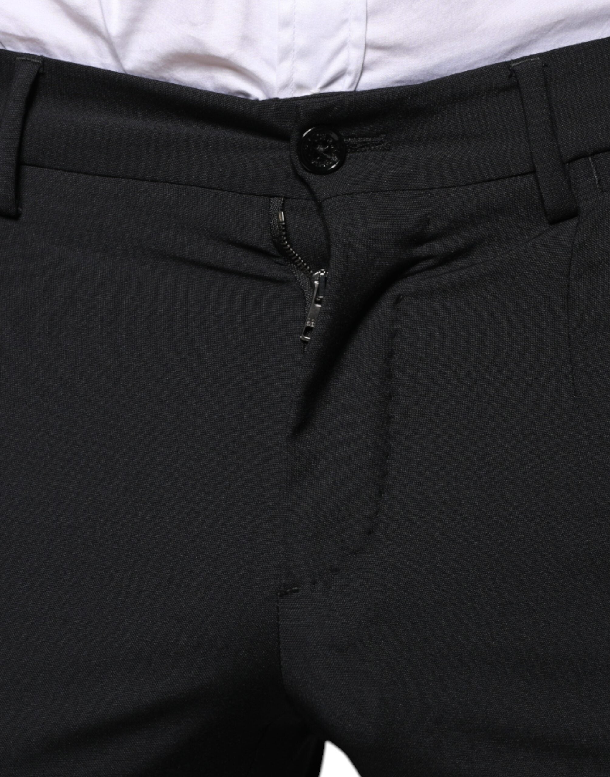 Black wool three-piece slim fit formal men's suit by Dolce & Gabbana, featuring a tailored jacket, vest, and trousers.