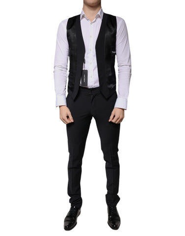 Black wool men's 3-piece slim fit formal suit by Dolce & Gabbana, includes blazer, vest, and trousers, displayed on a hanger.