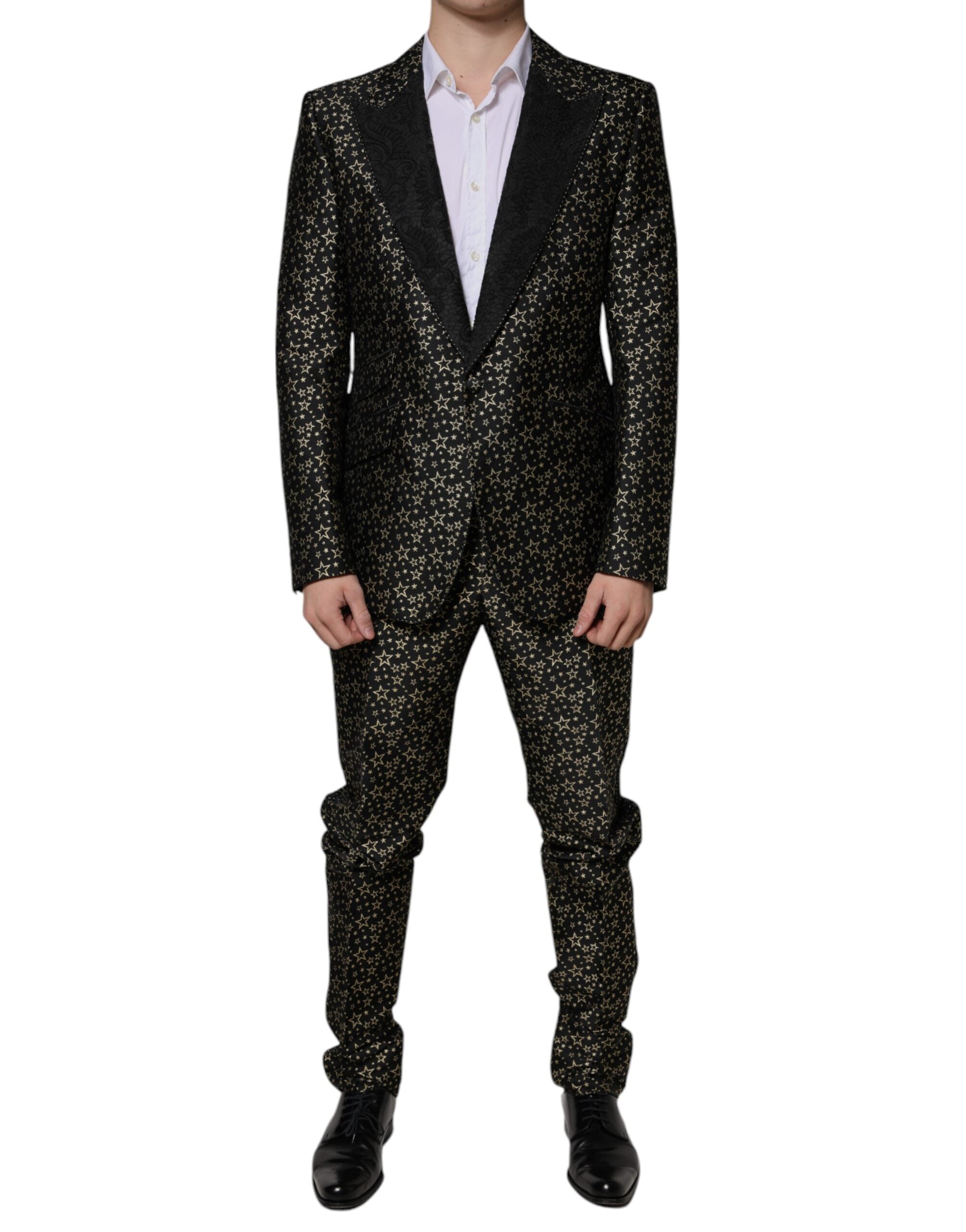 Black Stars Jacquard Sicilia 2-piece suit by Dolce & Gabbana, featuring a tailored blazer and matching trousers with star pattern.