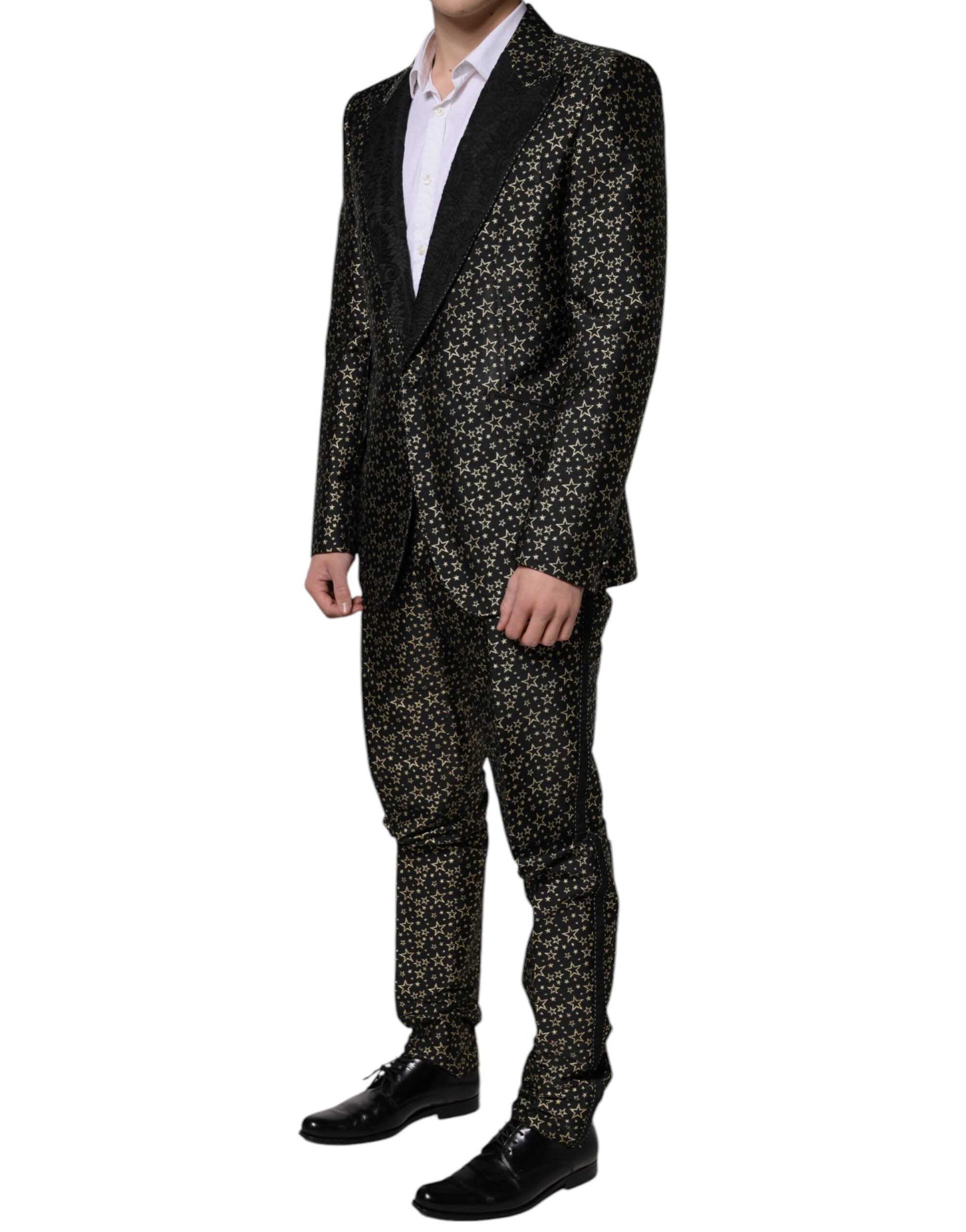 Black Stars Jacquard Sicilia 2-piece suit by Dolce & Gabbana, featuring a tailored blazer and matching trousers with star pattern.