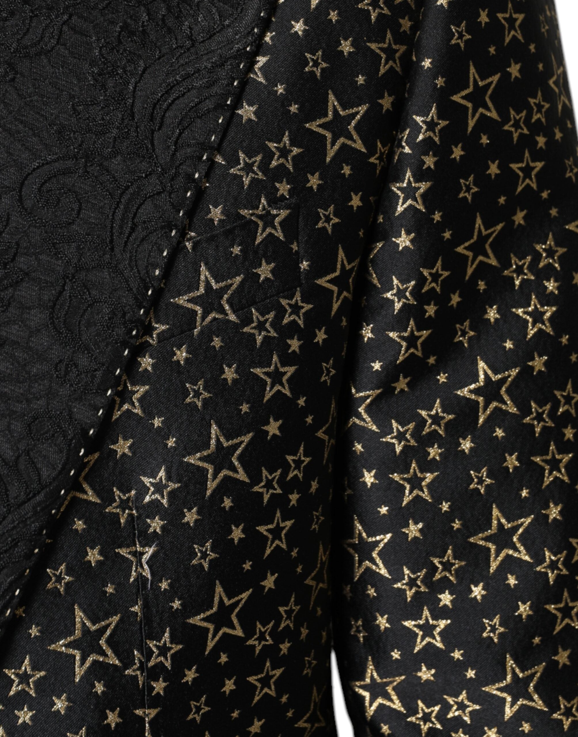 Black Stars Jacquard Sicilia 2-piece suit by Dolce & Gabbana, featuring a tailored jacket and matching trousers with star pattern.