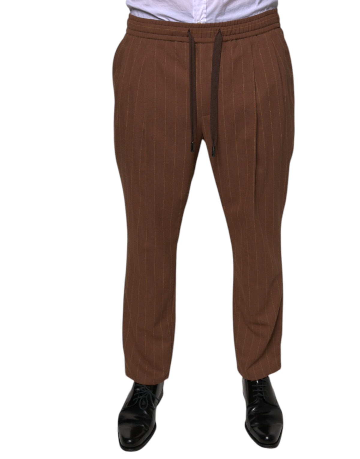 Brown striped skinny men's dress pants by Dolce & Gabbana, tailored fit with a stylish pattern, shown on a model.