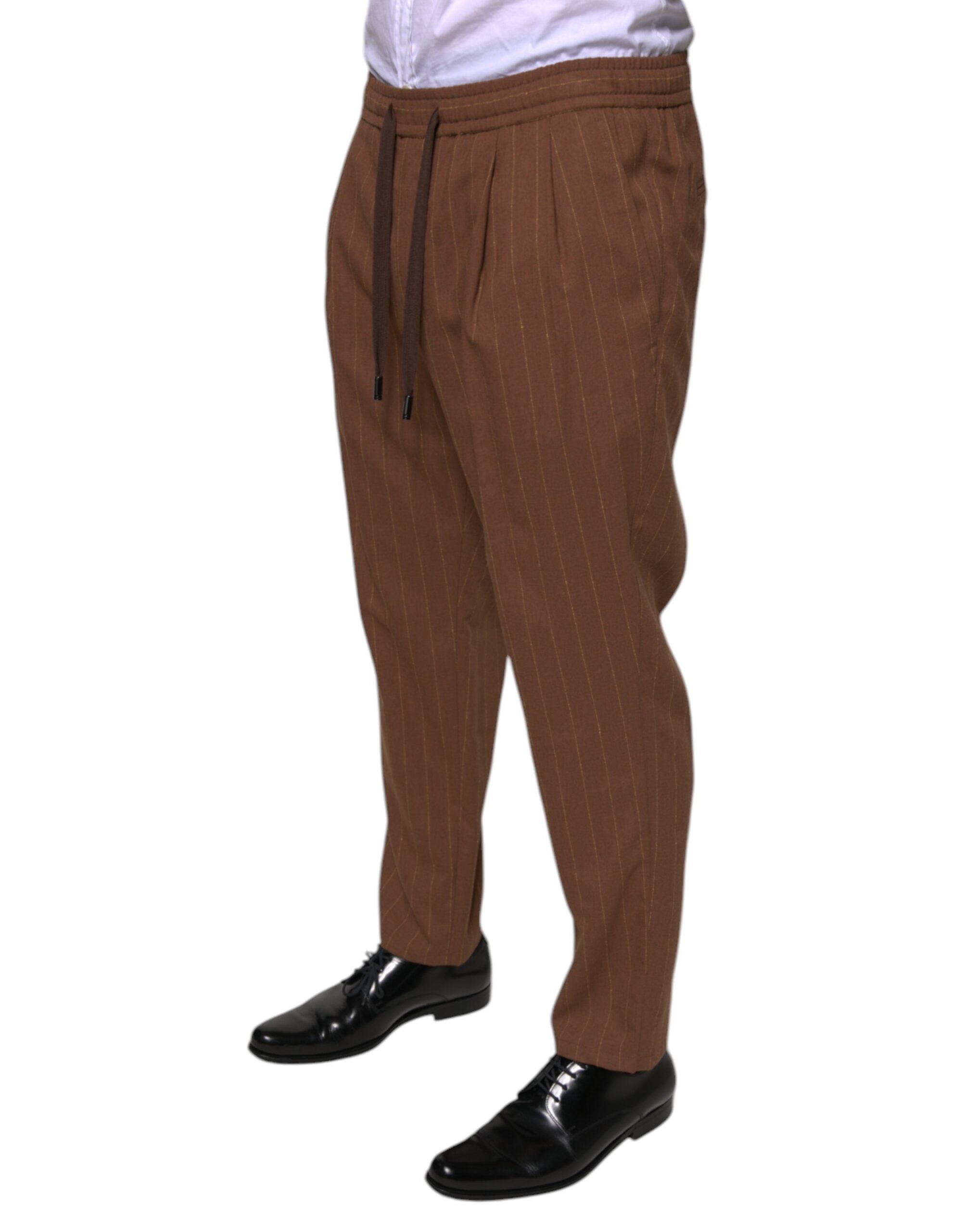 Brown striped skinny men's dress pants by Dolce & Gabbana, tailored fit with sharp crease and classic style.