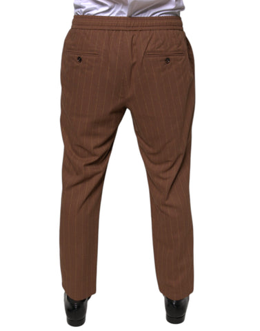 Brown striped skinny men's dress pants by Dolce & Gabbana, tailored fit with sharp creases and stylish design.