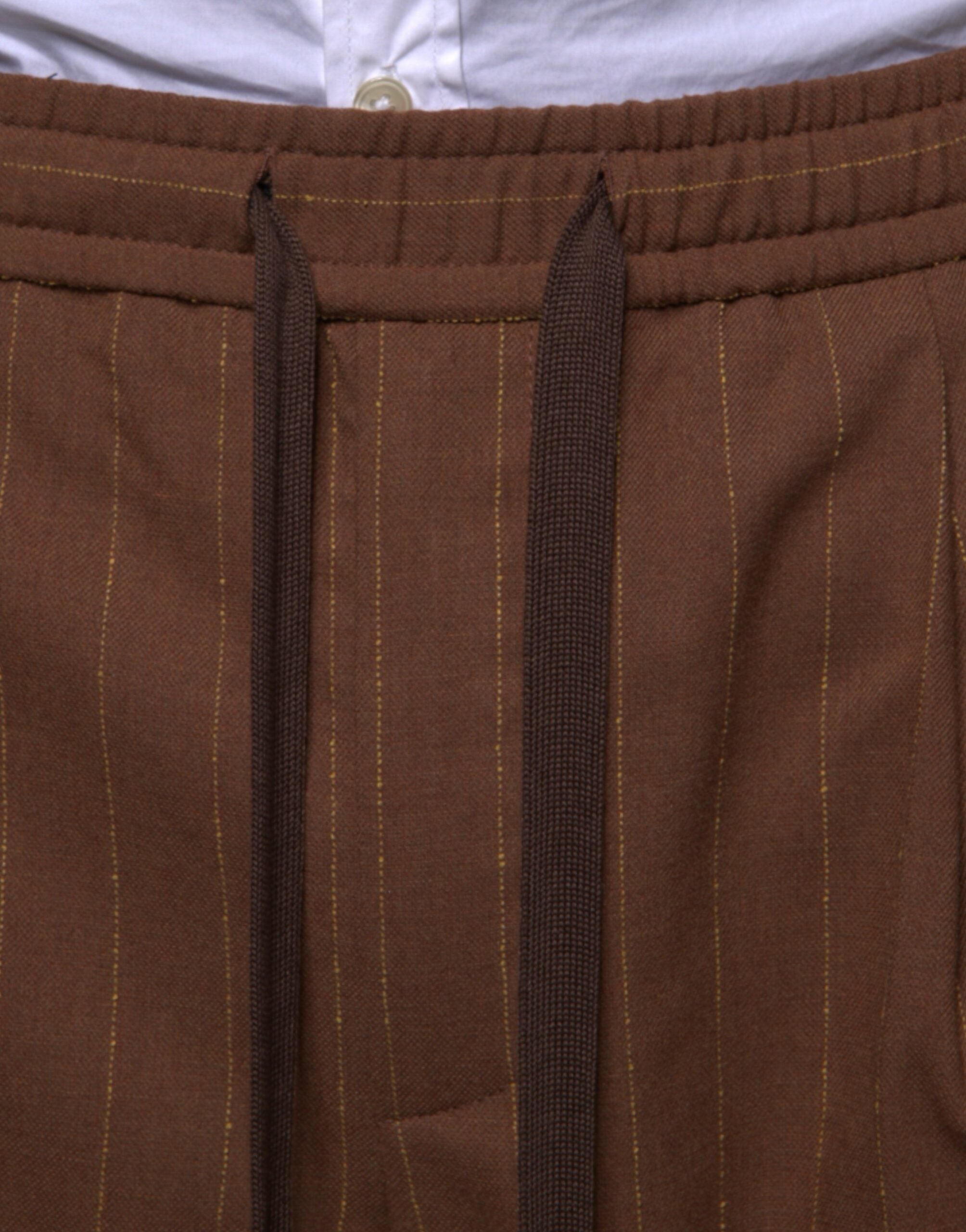 Brown striped skinny men's dress pants by Dolce & Gabbana, tailored fit with sharp lines and classic style.