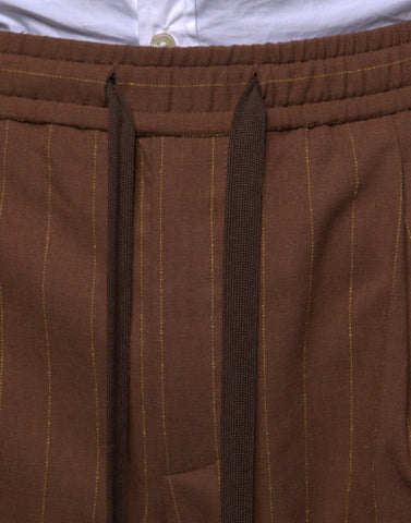 Brown striped skinny men's dress pants by Dolce & Gabbana, tailored fit with sharp lines and classic style.