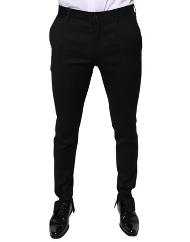 Black wool skinny formal dress pants by Dolce & Gabbana, tailored fit with sleek waistband and classic design.