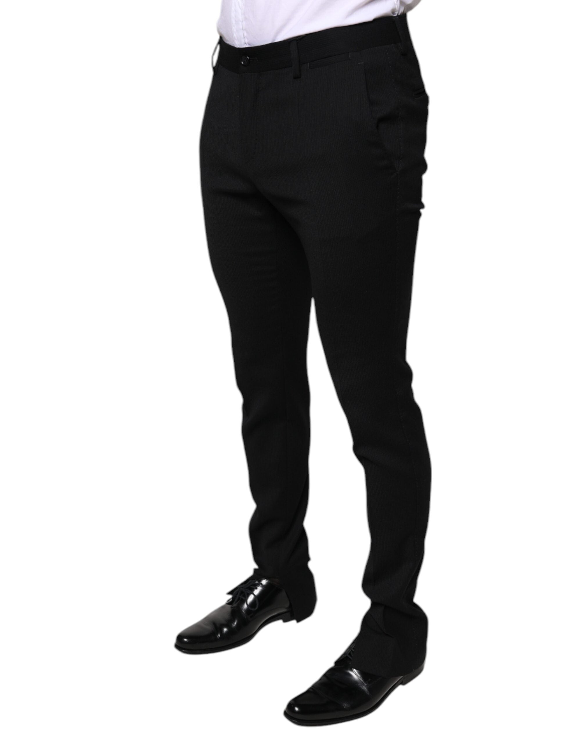 Black wool skinny formal dress pants by Dolce & Gabbana, tailored fit with sleek appearance and classic waistband.