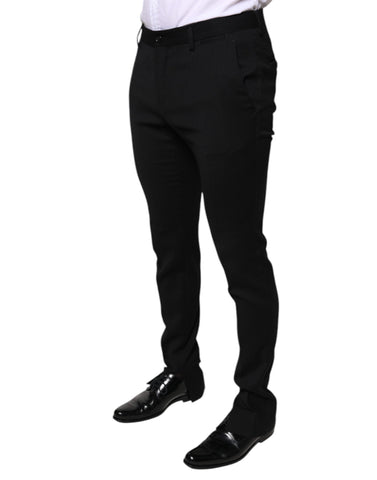 Black wool skinny formal dress pants by Dolce & Gabbana, tailored fit with sleek appearance and classic waistband.