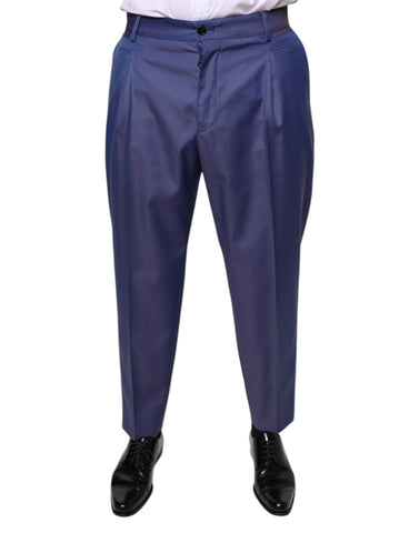 Blue wool tapered formal dress pants by Dolce & Gabbana, shown on a model with a tailored fit and classic crease.