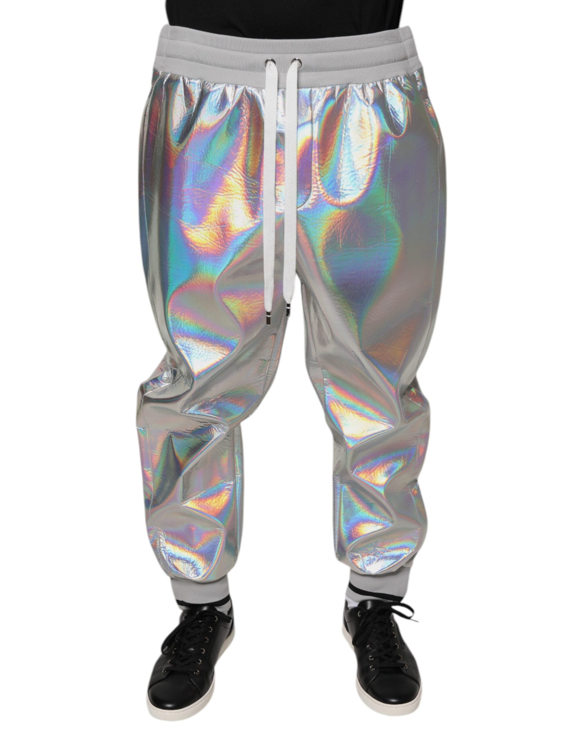 Silver iridescent men's jogger sweatpants by Dolce & Gabbana with elastic waistband and tapered fit, shown on a plain background.