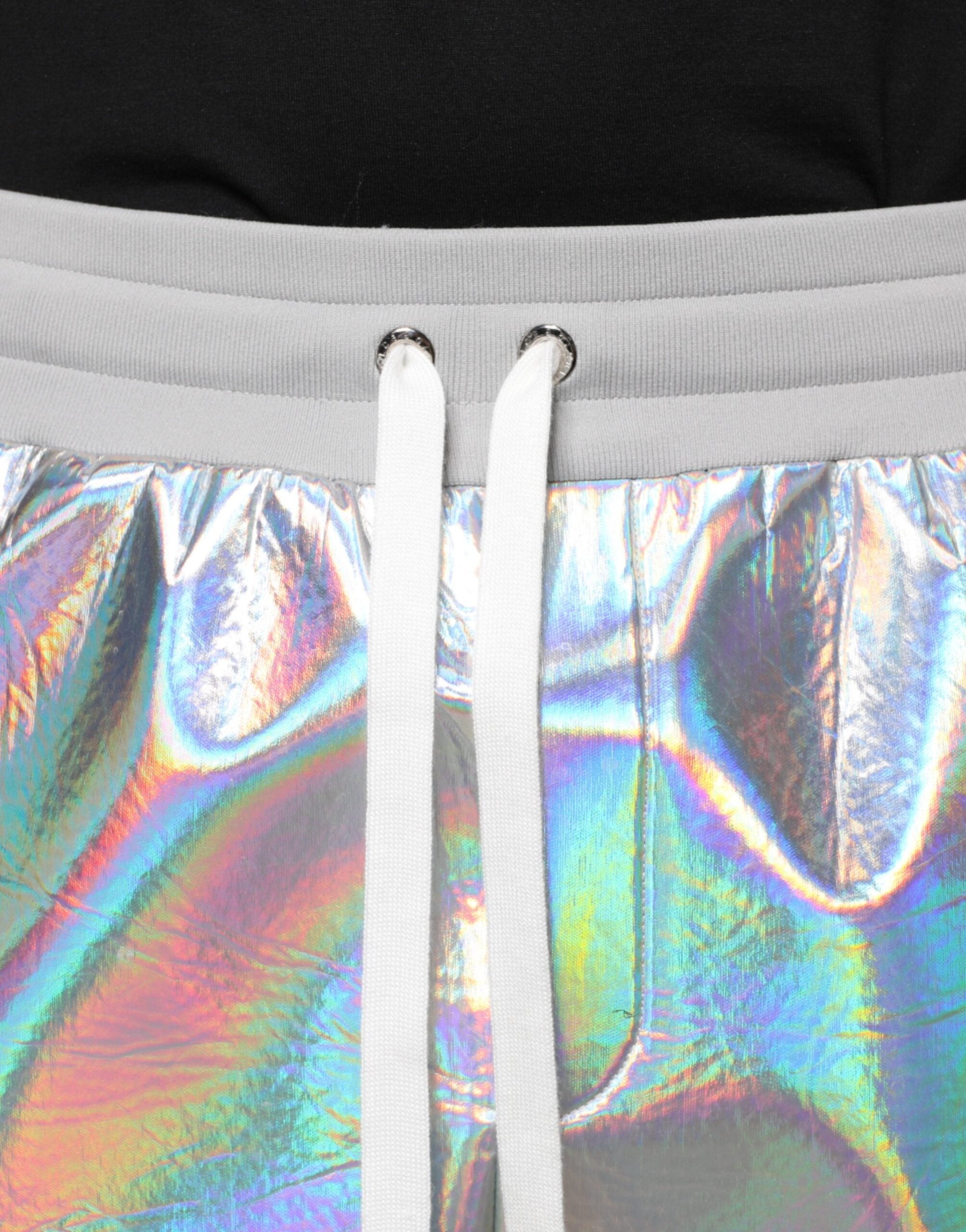 Silver iridescent men's jogger sweatpants by Dolce & Gabbana, featuring a sleek, shiny fabric with elastic waistband and tapered fit.