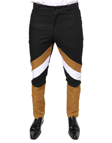 Multicolor stripe skinny cotton pants by Dolce & Gabbana, featuring vibrant vertical stripes and a fitted silhouette.