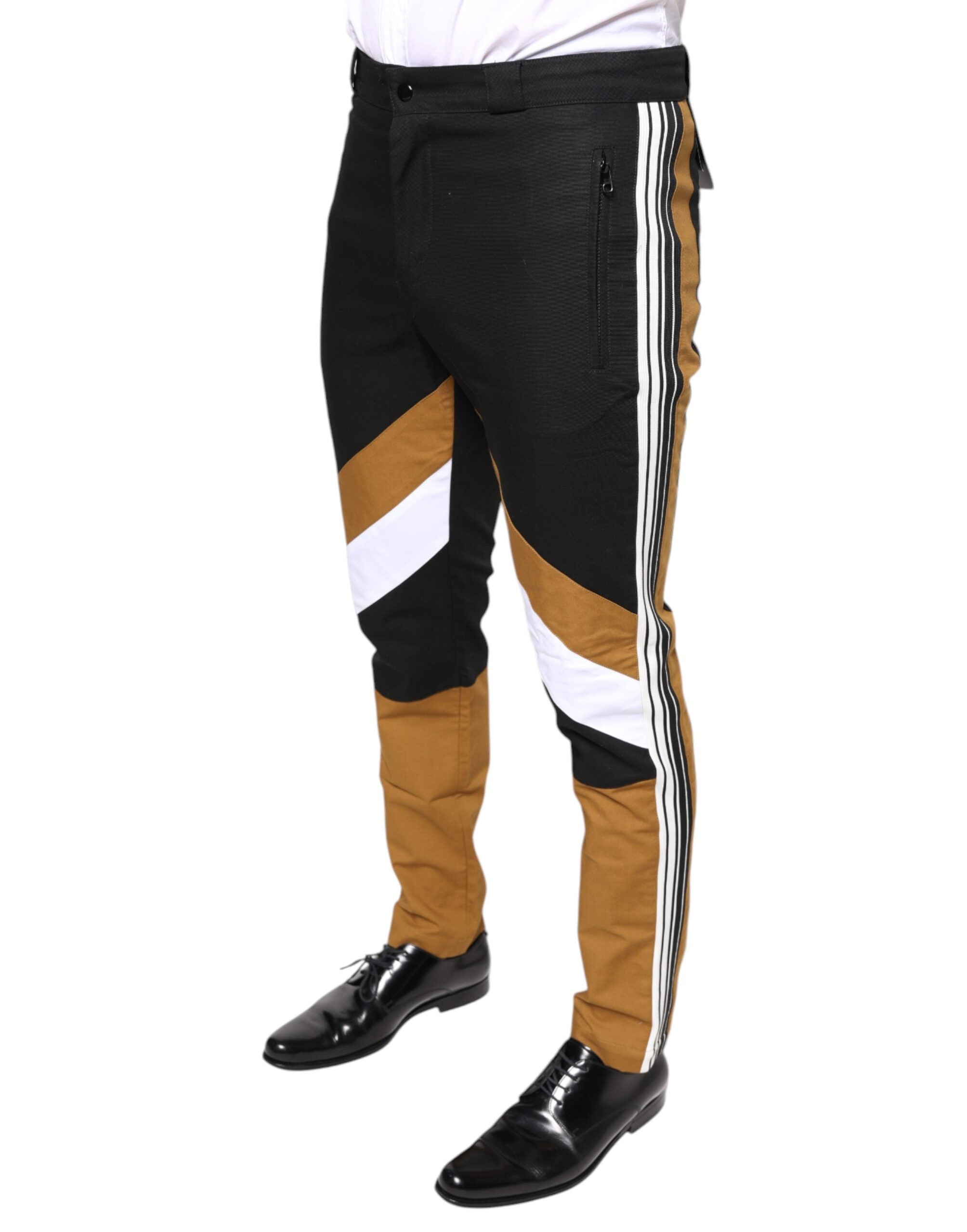 Multicolor striped skinny cotton pants by Dolce & Gabbana, featuring vibrant vertical stripes and a slim fit design.
