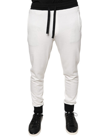 White cotton slim men's jogger sweatpants from Dolce & Gabbana, featuring a relaxed fit and elastic waistband.