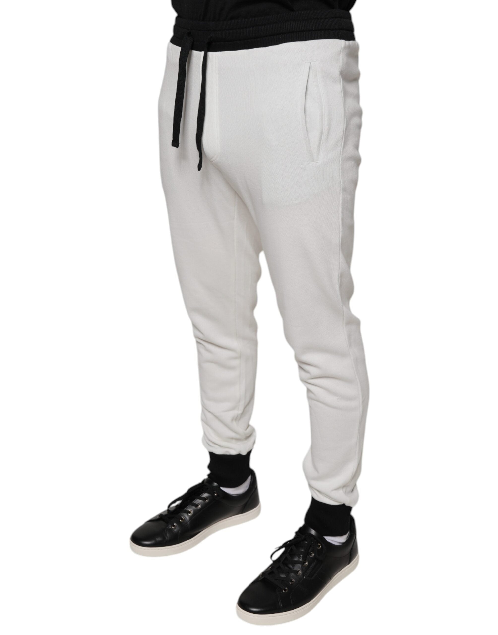 White cotton slim fit men's jogger sweatpants by Dolce & Gabbana, featuring a relaxed fit and elastic waistband.