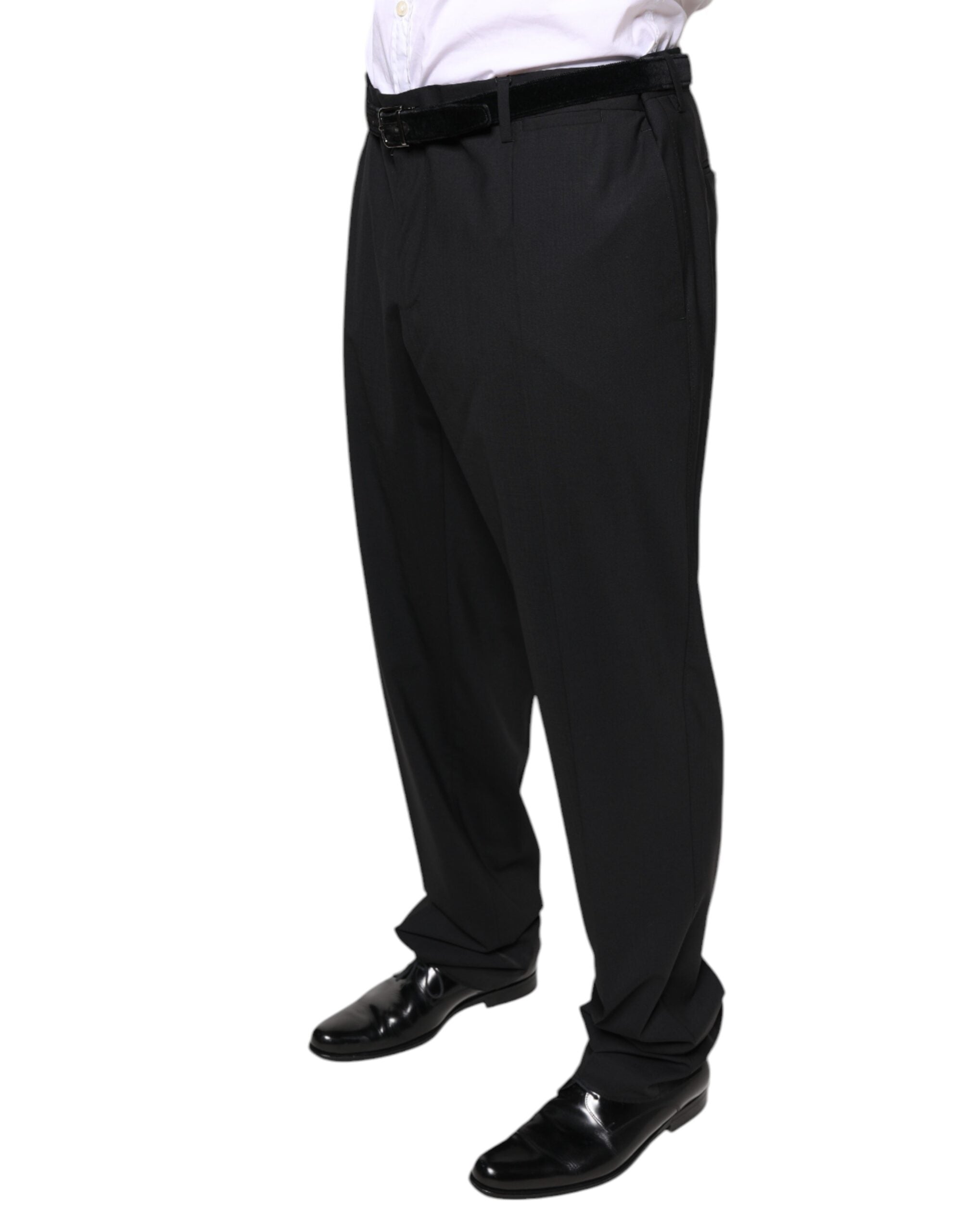Black wool men's formal dress pants by Dolce & Gabbana, tailored fit with classic crease and side pockets, shown on a hanger.