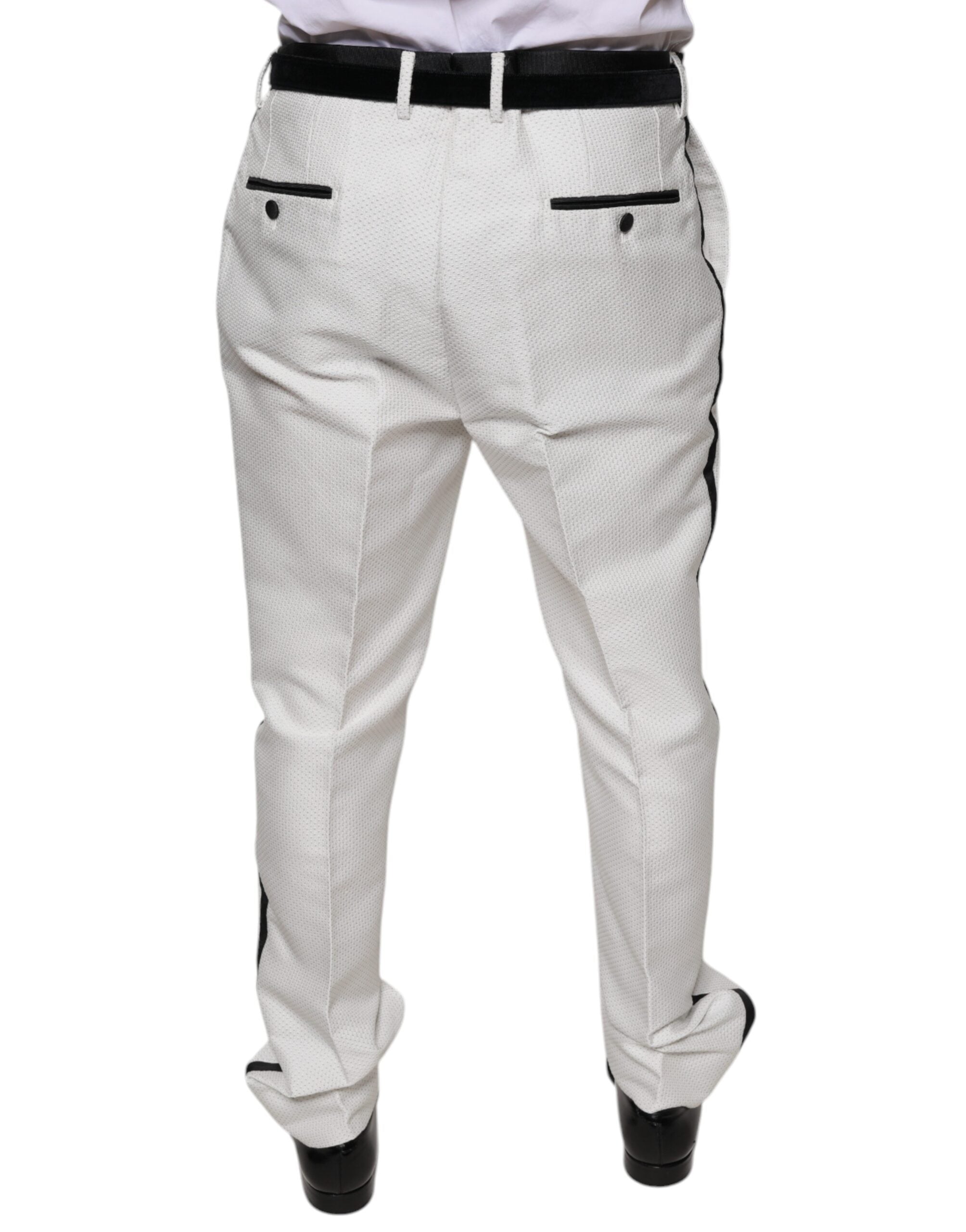 White polyester formal dress pants by Dolce & Gabbana, tailored fit with classic style, shown on a hanger.