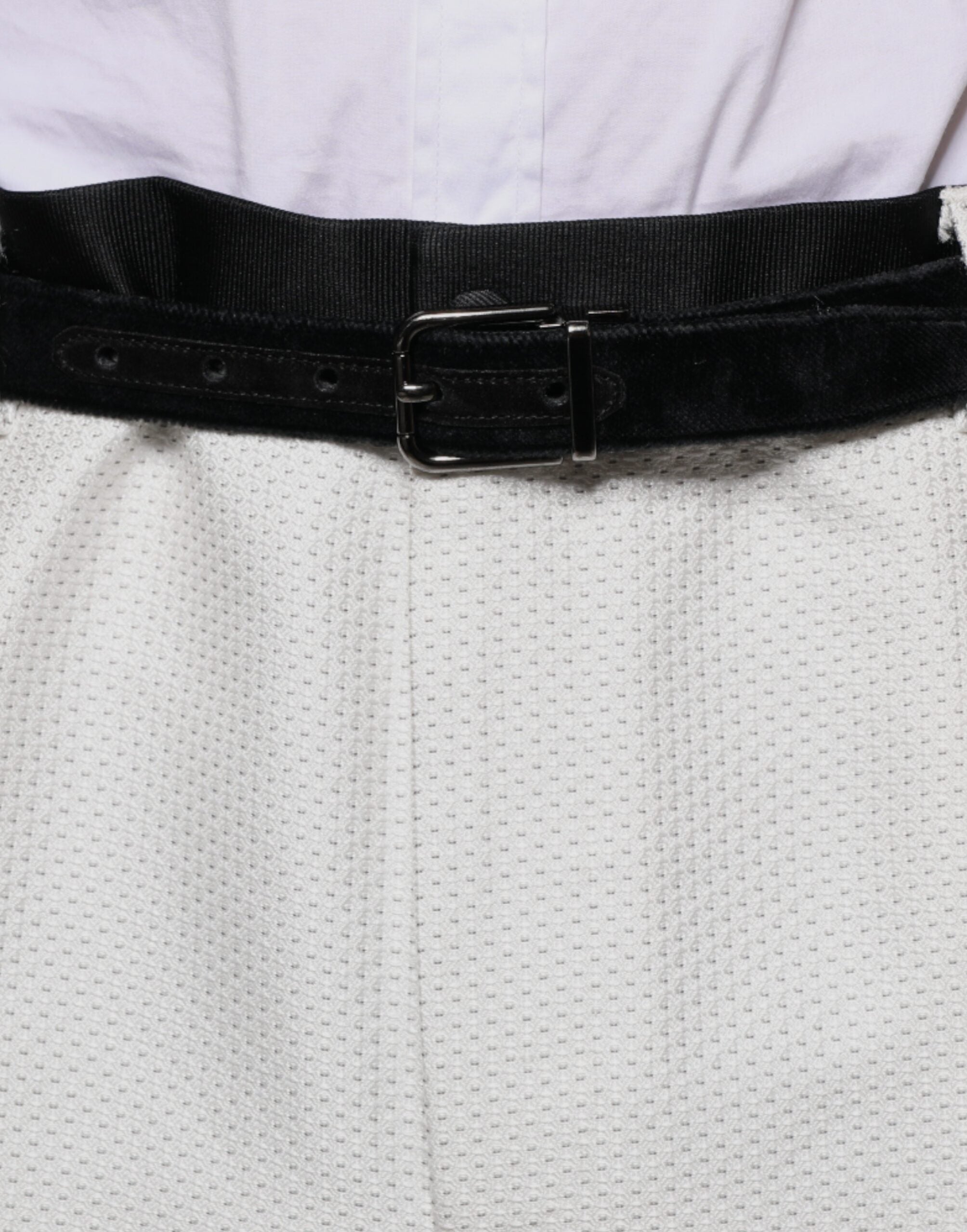 White polyester formal dress pants by Dolce & Gabbana, tailored fit with sleek waistband and classic crease design.