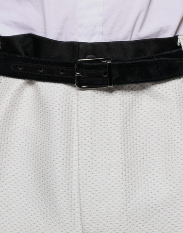White polyester formal dress pants by Dolce & Gabbana, tailored fit with sleek waistband and classic crease design.