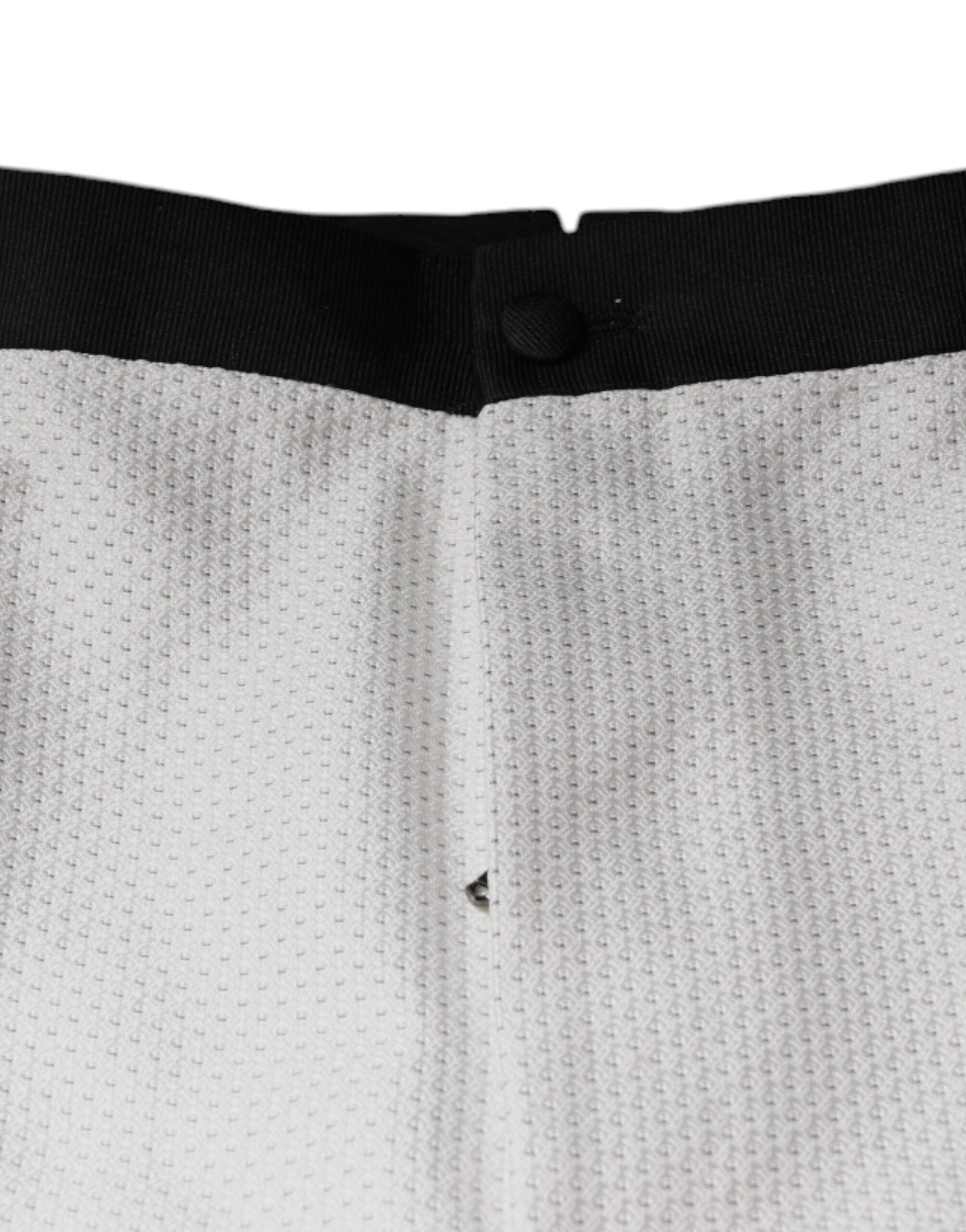 White polyester formal dress pants by Dolce & Gabbana, tailored fit with sleek design and classic waistband.
