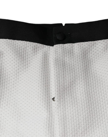 White polyester formal dress pants by Dolce & Gabbana, tailored fit with sleek design and classic waistband.