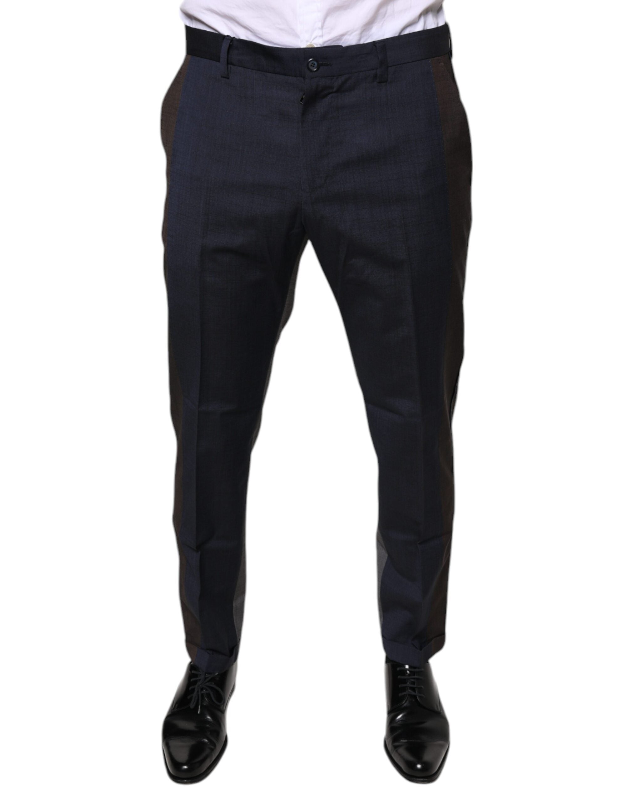 Black cotton wool formal dress pants by Dolce & Gabbana, tailored fit with classic design, shown on a hanger.