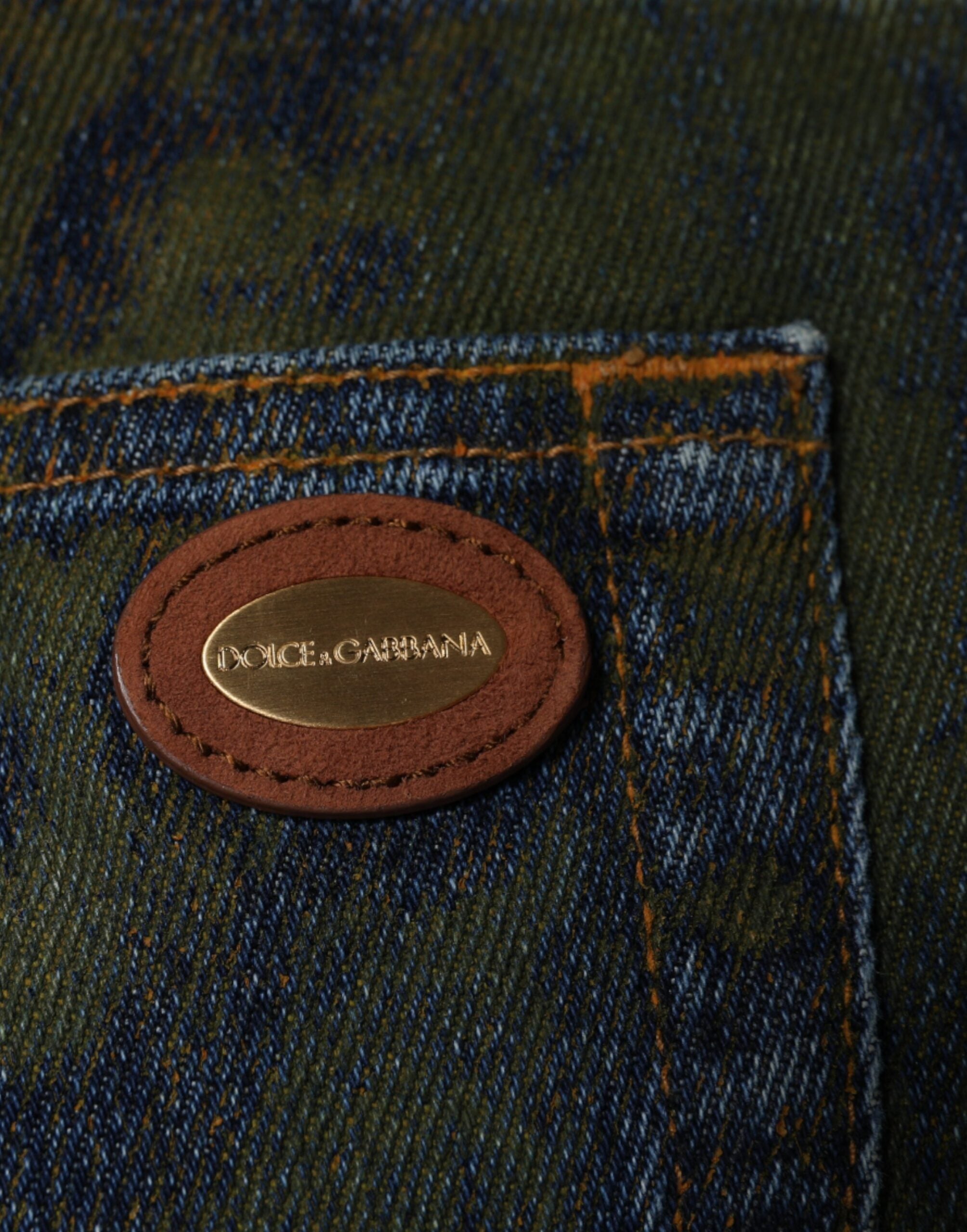Blue cotton dye slim fit men's denim jeans by Dolce & Gabbana, showing close-up of fabric and fit details.