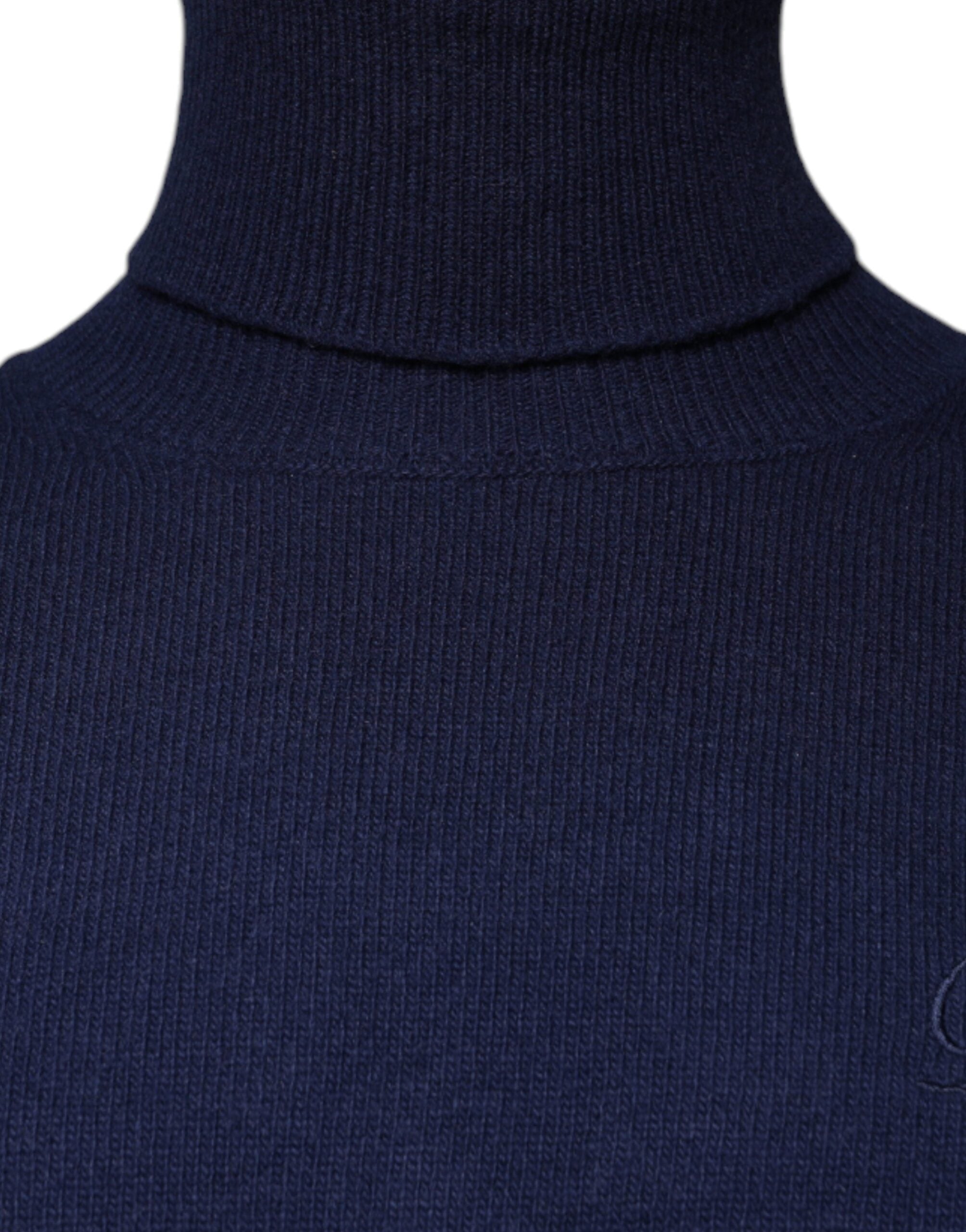 Blue wool knit turtleneck sweater by Dolce & Gabbana with a close-up of the textured fabric and classic fit.
