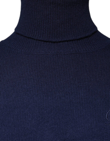Blue wool knit turtleneck sweater by Dolce & Gabbana with a close-up of the textured fabric and classic fit.