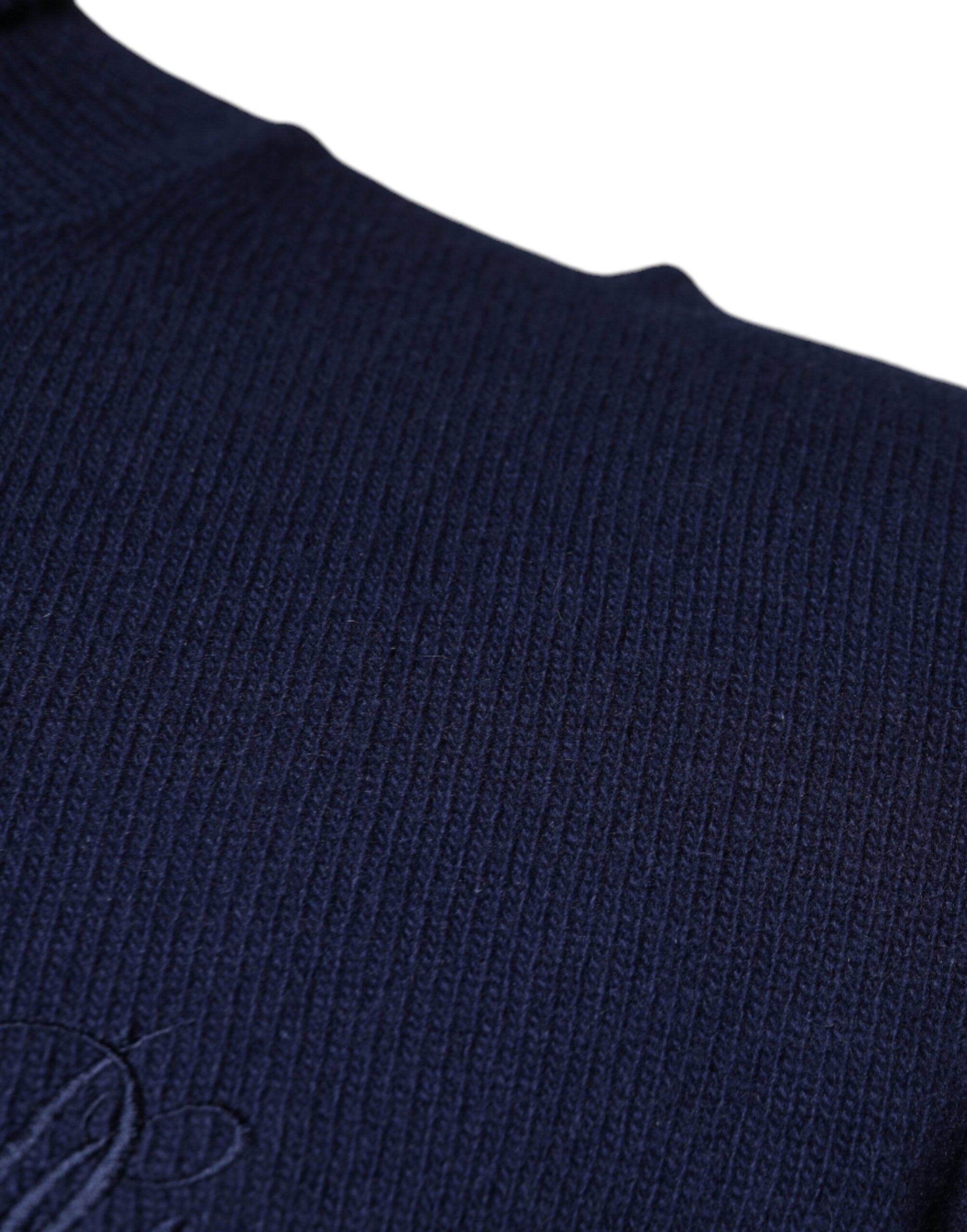 Blue wool knit turtleneck pullover sweater by Dolce & Gabbana, showing the cozy, textured fabric and classic turtleneck design.