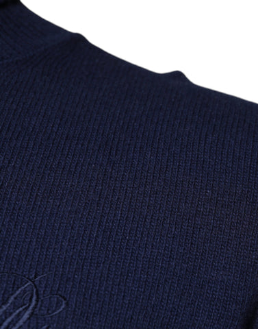 Blue wool knit turtleneck pullover sweater by Dolce & Gabbana, showing the cozy, textured fabric and classic turtleneck design.