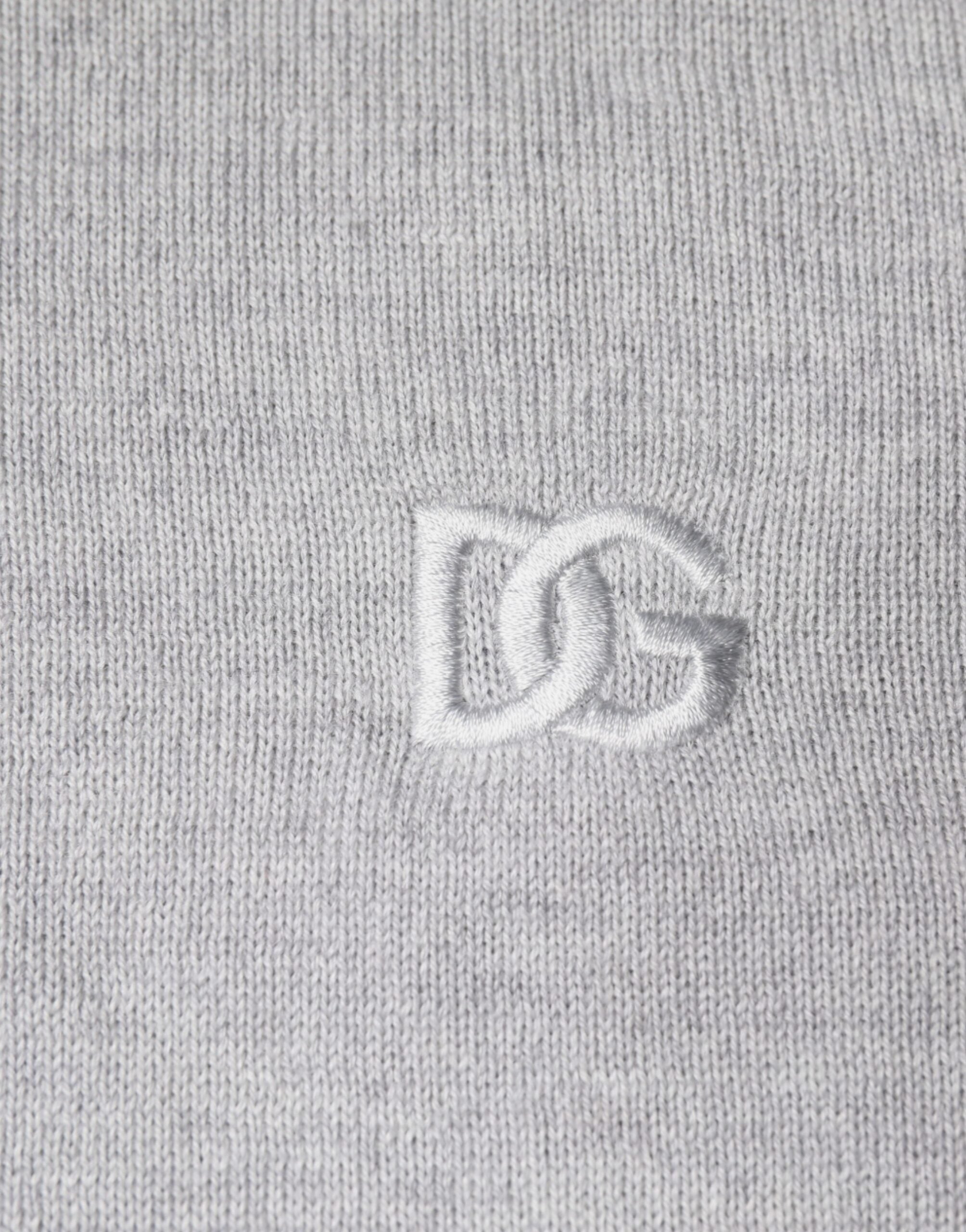 Light gray wool crew neck pullover sweater by Dolce & Gabbana, showing soft fabric and classic fit on a plain background.