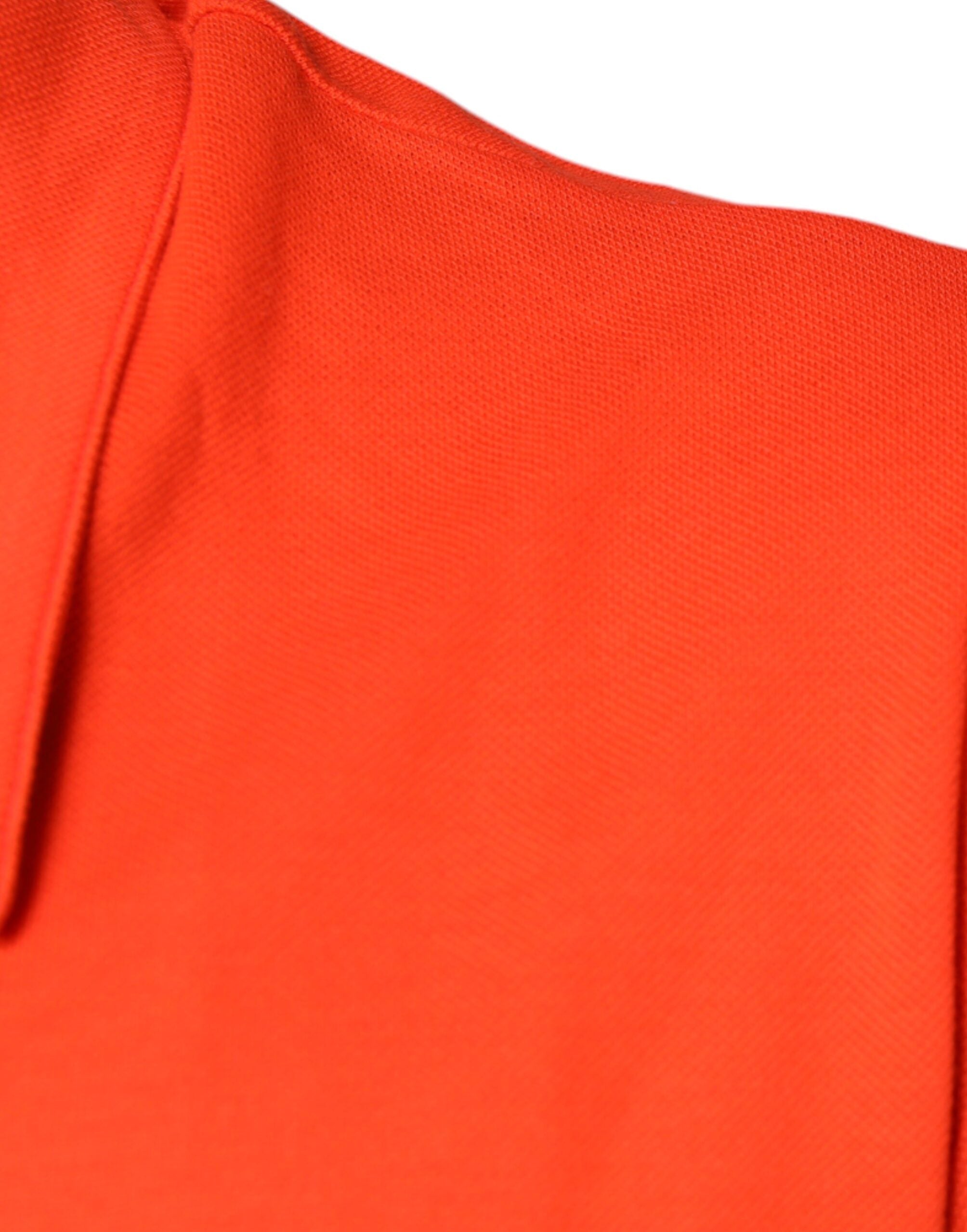 Orange cotton button-down casual polo shirt by Dolce & Gabbana, displayed on a hanger.