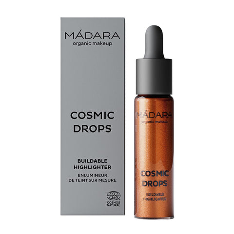 Mádara Cosmic Drops Illuminator 03 Burning Meteorite in 13.5ml bottle with a sleek, dark glass design and metallic cap.