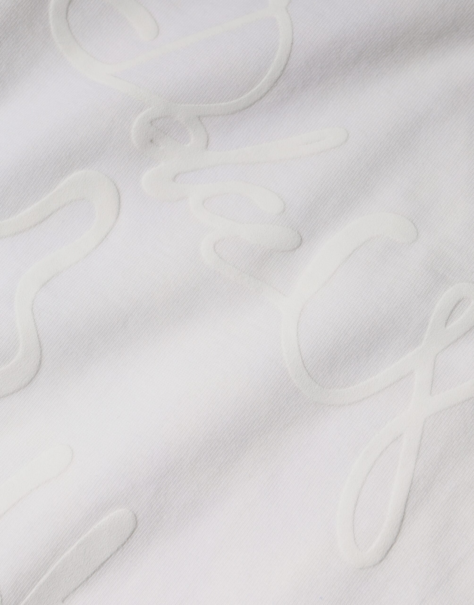 White cotton crew neck T-shirt with Dolce & Gabbana logo print, featuring a casual fit and classic design.
